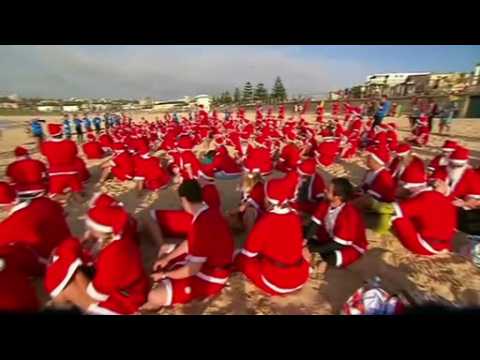 Surfing Santas set world record