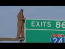 Man faces charges for climbing on highway sign