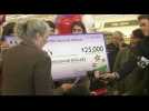 TN store owner receives check for selling winning Powerball ticket