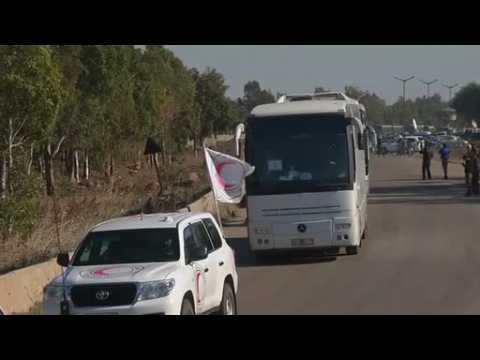 Syrian rebels and civilians leave Homs in truce deal