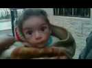 Starvation looms for besieged Syrian town