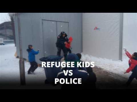 Adorable: Refugee kids take on police in snowball fight