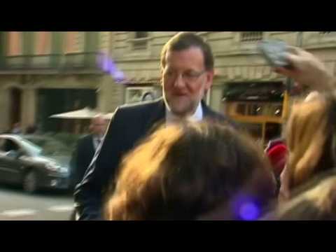 Spain's Rajoy back to campaigning after punch in face