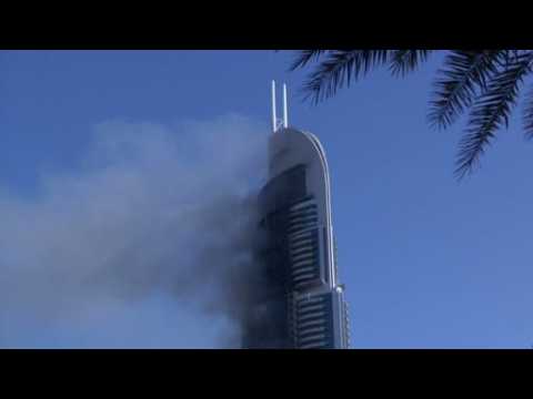 Smoke billows from Dubai skyscraper after raging fire