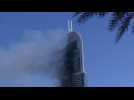 Smoke billows from Dubai skyscraper after raging fire