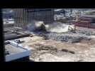 Parking garage wall collapses during demolition