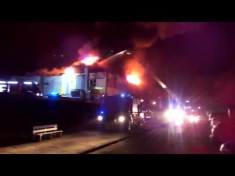 Dramatic video emerges of Polish shopping mall on fire at night