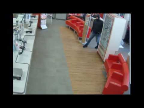 Security guard uses helmet to fight UK Post Office robber