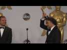 Alejandro Gonzalez Inarritu Places His Oscar Award On His Head