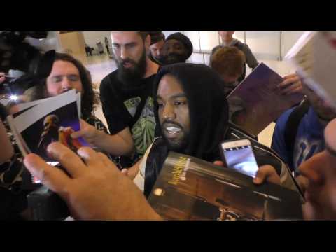 Kanye West Is Barraged By Fans And Paparazzi