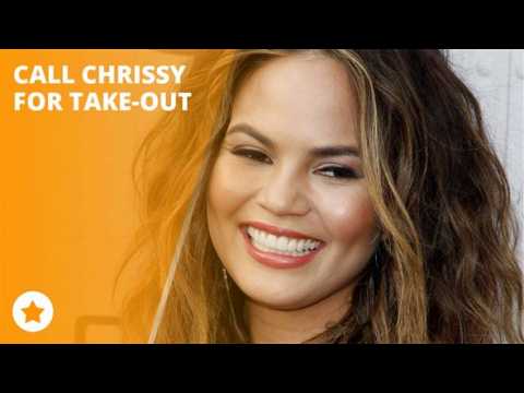 Chrissy Teigen's dog outs her phone number!