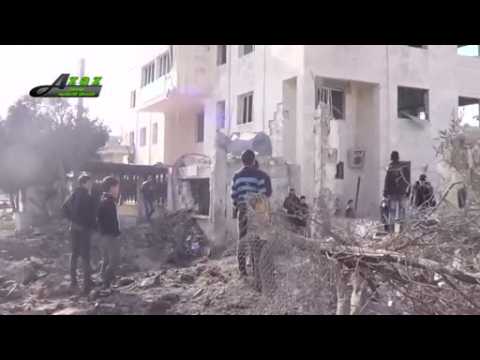 Missiles hit school and hospital in Syrian border town, 14 dead - residents