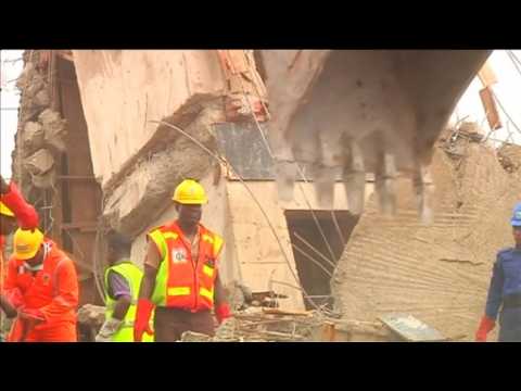 Rescuers dig for survivors after Nigeria building collapse