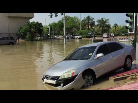 Vehicles half-submerged on Dubai's flooded streets