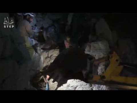 Rescuers pull a child from rubble after Idlib airstrike - amateur video