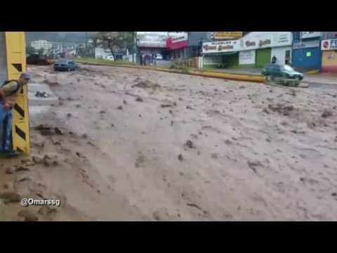 Heavy rains turn street into river in Venezuela