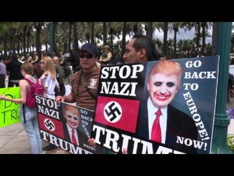 Pro and anti Trump protesters row outside California rally