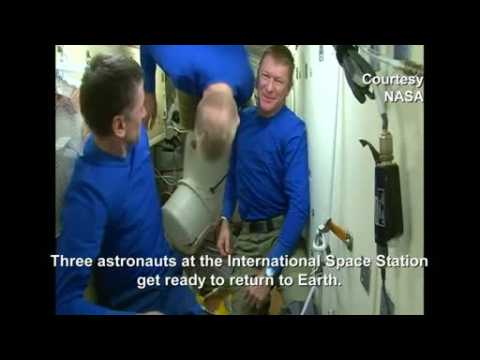Space capsule undocks as astronauts return to Earth