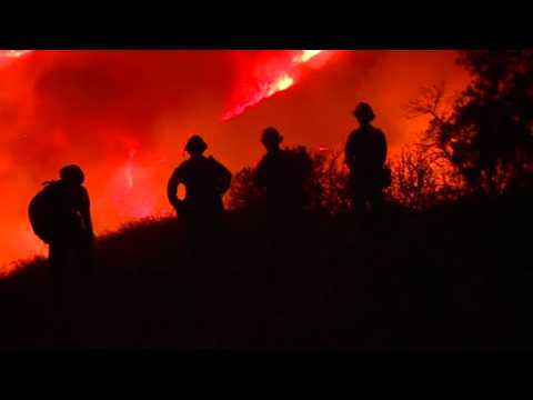 Firefighters battle wildfires in California