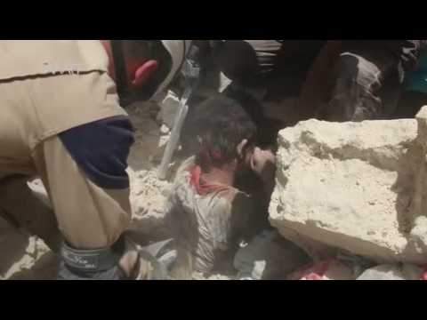 Rescuers pull child from rubble after Russian airstrike in Aleppo - report