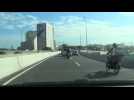 Dramatic video shows motorcyclist getting knocked off highway overpass