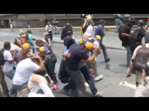 Opposition leader Capriles hit with tear gas in Caracas protest