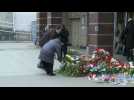Flowers, candles laid for victims of Russia metro attack