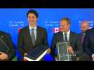 EU, Canada sign free trade deal but battle not over