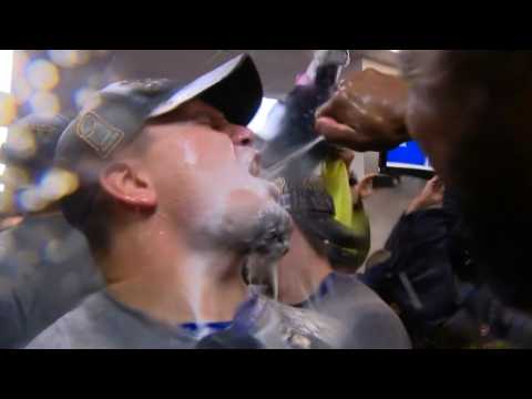 Cubs players break out the victory champagne