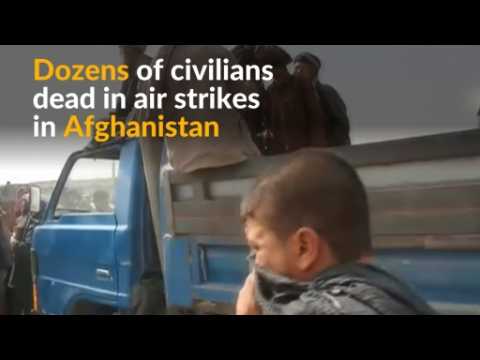 Dozens of Afghan civilians and two U.S. service members killed in air strikes
