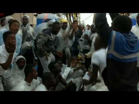 Celebrations at sea; rescued migrants dance with joy