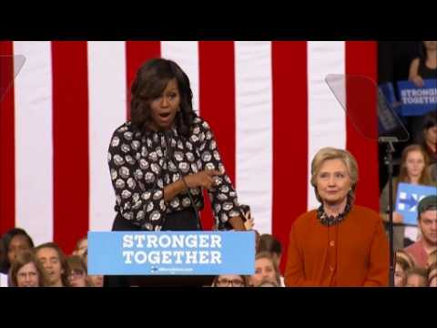 Clinton absolutely ready, "happens to be a woman," says Michelle Obama