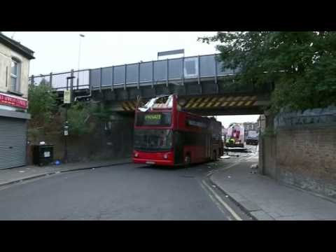 Double-decker bus hits bridge in London