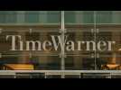 Time Warner, AT&T shares fall