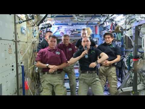 Hugs aboard space station after change of command