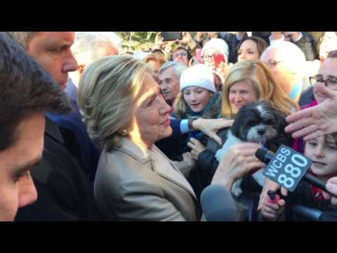 Hillary Clinton greets supporters after casting her vote
