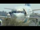 TV footage shows passengers escaping hijacked plane