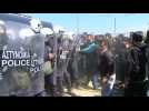 Stranded migrants scuffle with police at Greek border