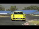 Porsche 911 Carrera GTS Coupe in Racing Yellow Driving on the Track | AutoMotoTV