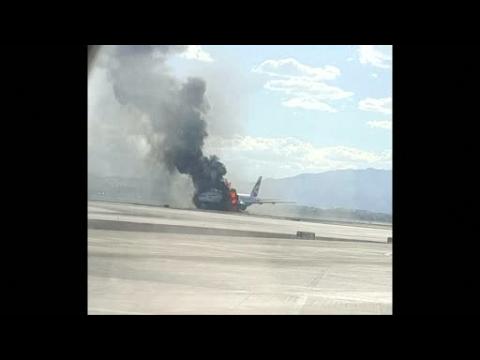 Photographs show British Airways plane on fire at a Las Vegas airport