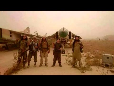 Rebels take northwestern Syrian air base - state TV and rebel photographs