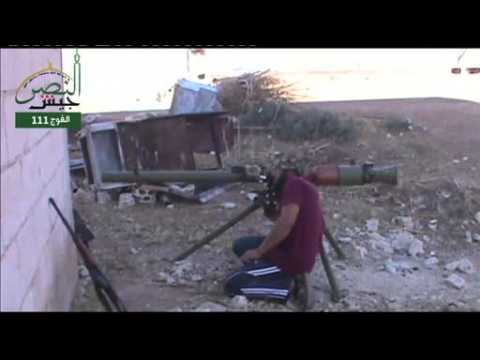 Syrian rebels target government soldiers with missile and gun fire  - amateur video