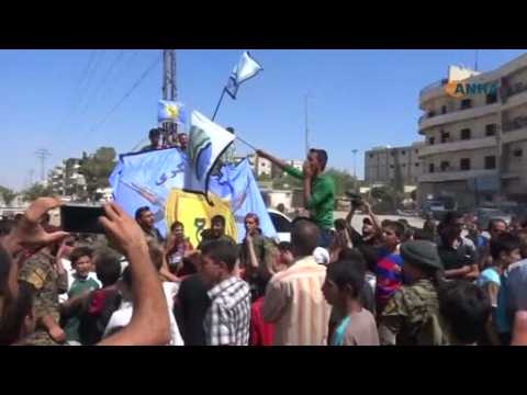 Syrians celebrate in Manbij as death strikes in Daraya