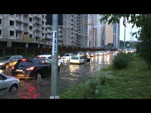 Russians wakeboard in Moscow street after torrential rain