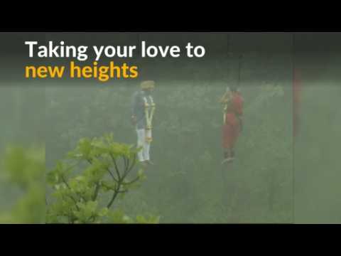 Indian couple dangle above gorge to exchange wedding vows