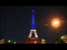 Red,white, blue Eiffel Tower in homage to Nice attack victims