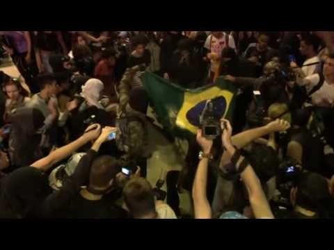 Demonstrators burn Brazilian flag in Rio protests