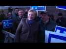 Hillary greets voters, New Hampshire polls open