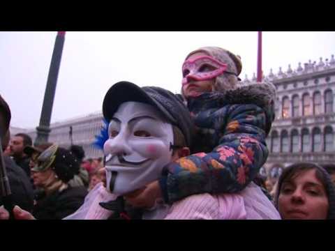 Revellers show off their masks in Venice Carnival