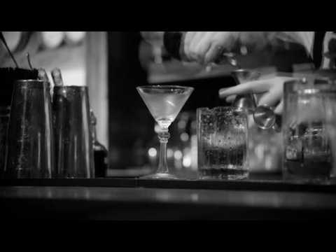 A bartender presents a 100 years of cocktails